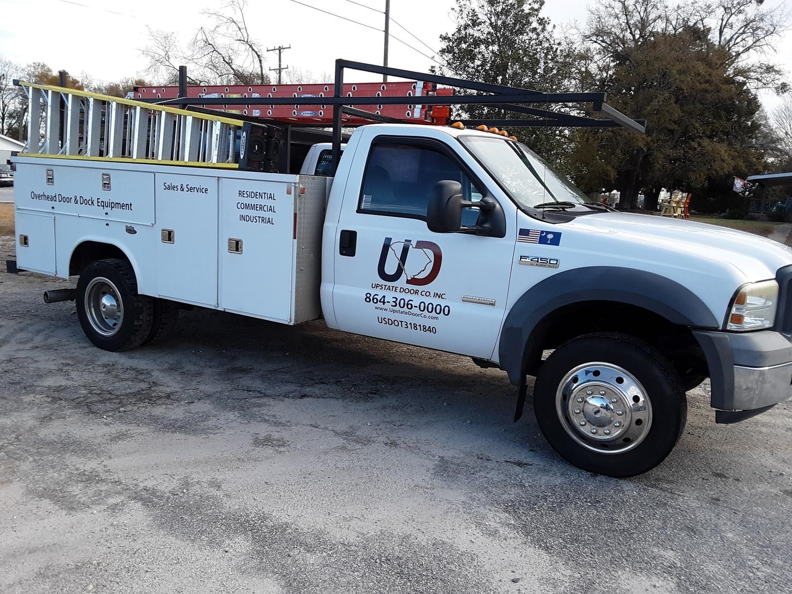 Piedmont and Greenville Garage Door Company Upstate Door Co photo of trucks